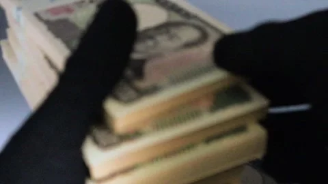 Video of a person counting stacks of bills Stock Footage 325695262