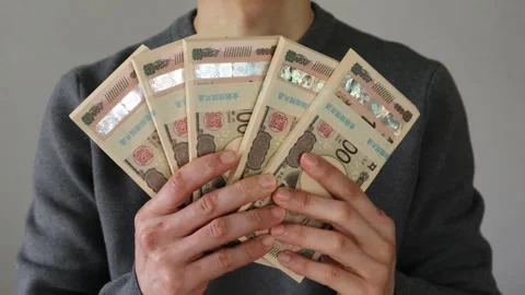 Video of a person holding a stack of bills Stock Footage 324547026