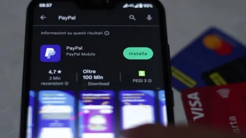 Video of a person installing and using the PayPal mobile app on a smartphone Stock Footage 241155805