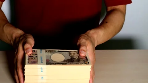 Video of a person paying a large sum of money Stock Footage 334738871