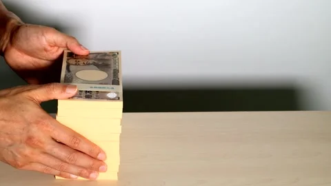 Video of a person paying a large sum of money Stock Footage 334743045
