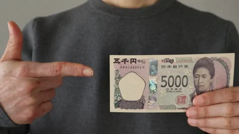 Video of a person pointing at the new 5,000 yen bill Video stock 324545477