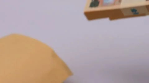 Video of a person taking out a paycheck from an envelope Stock Footage 325694679