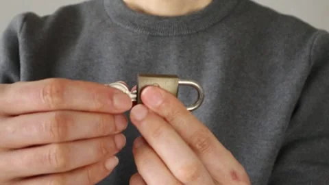 Video of a person unlocking a padlock Video stock 324544252