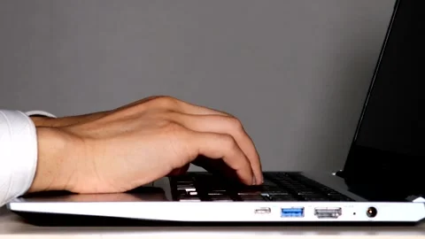 Video of a person using a computer 動画素材 334943539