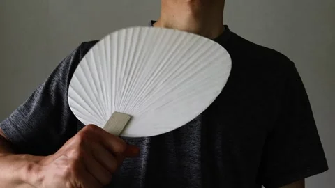 Video of a person using a fan Stock Footage 323503471