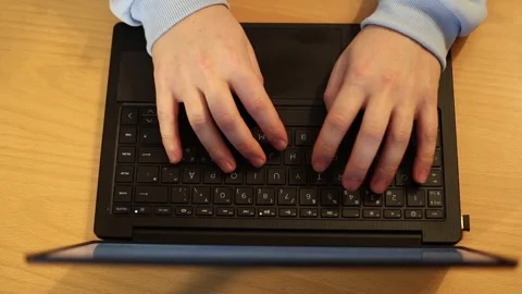 Video of a person using a laptop to check cryptocurrency charts while typing Stock Footage 322095893