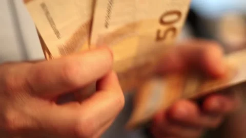 Video of a person using a laptop to check cryptocurrency charts while typing Stock Footage 322095976