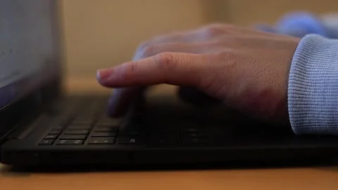 Video of a person using a laptop to check cryptocurrency charts while typing Stock Footage 322096008