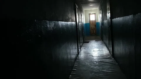 Video from the perspective of someone walking down a dark, creepy corridor Видео 331464345