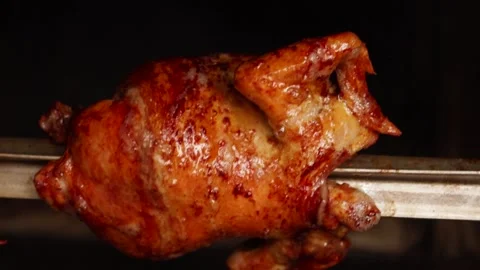 Video of peruvian food called "pollo a la brasa" going around in an oven. Stock Footage 231541245