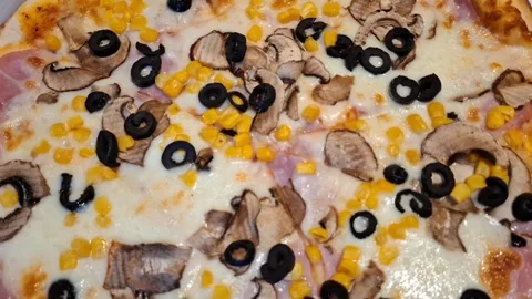 Video of pizza with ham, mozzarella and other vegetables Video stock 299621731