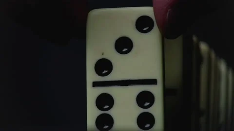 Video of placing domino elements on black Stock Footage 153195783