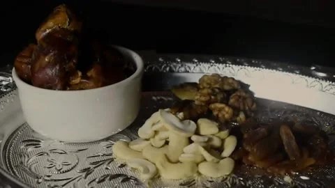 A Video of plate full if dry fruits like cashew, walnut, resin and dates. Stock Footage 166304848