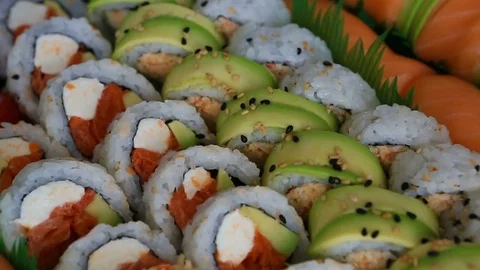 Video of a platter of sushi rolls with both raw and cooked ingredients 1080p HD Stock Footage 81985062