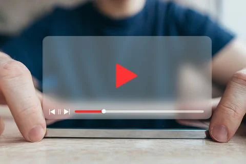 Video player interface concept. The person is using a smartphone. Stock Photos