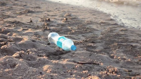 Video of pollution on the beach in real slow motion Stock Footage