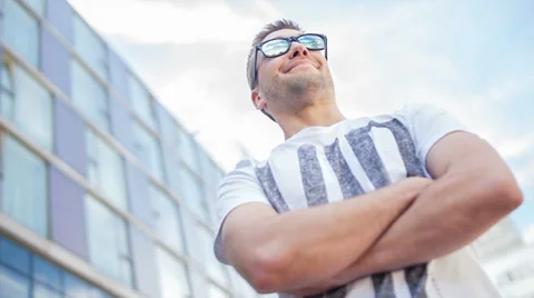 Video portrait of a confident man, low angled, wearing sunglasses Stock Footage 39343124