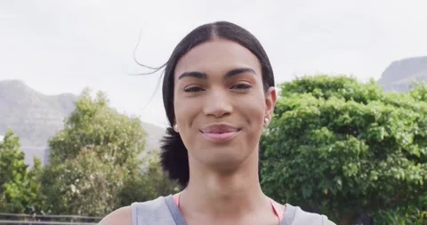 Video portrait of happy non binary transgender woman smiling to camera outdoors Stock Footage 342017841