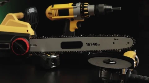 Video posting tool on a black background, drill, hammer, saw Stock Footage 98811565