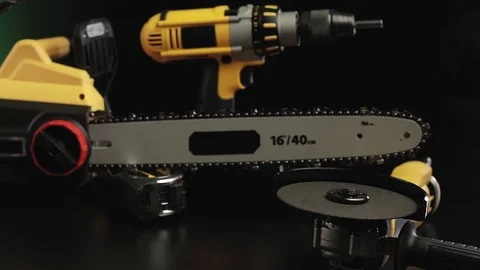 Video posting tool on a black background, drill, hammer, saw Stock Footage 98811566
