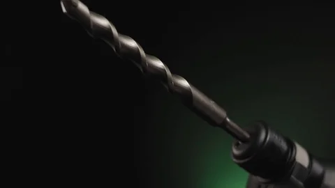 Video posting tool hammer drill on black background Stock Footage 98811586