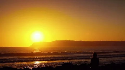 Video of practicing yoga at the sunset in real slow motion Stock Footage 77513791
