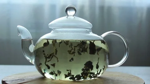 Video of Process of brewing green Chinese tea in a glass teapot Stock Footage 73954184