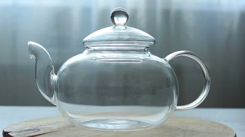 Video of Process of Pouring green Chinese tea in a glass teapot Stock Footage 73953675