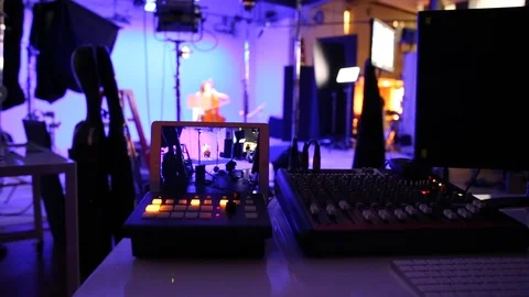 A video production team on location in a studio environment Stock Footage 89506185