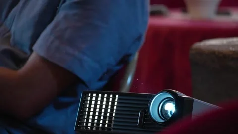 Video projector beaming light during a corporate seminar Stock Footage 334380960