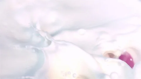 Video of radish falling into milk in real slow motion Stock Footage