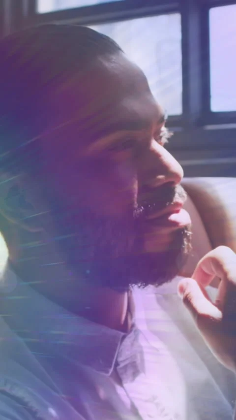 Video of rainbow lights over thoughtful man Stock Footage 342315752