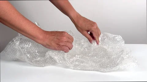 Video with real sound effect of  Bubble wrap popping Stock Footage 328616394