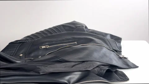  Video with real sound effect of Leather jacket dropping with zippers clinking Stock Footage 328609077