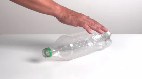 Video with real sound effect of  Plastic PET bottle rolling Stock Footage 328641128