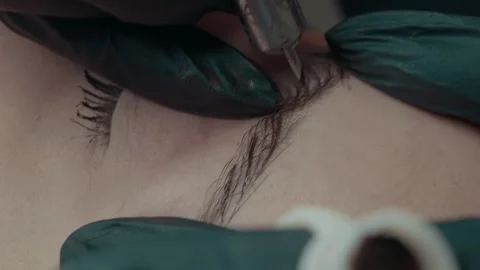 Video recording of microblading work. Permanent makeup on the brow. Stock Footage 223159255