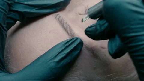 Video recording of microblading work. Permanent makeup on the eyebrow. Stock Footage 223159594