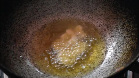 Video of roasting Cashew nuts in Ghee. It is used for making payasam a south Stock Footage 138514841