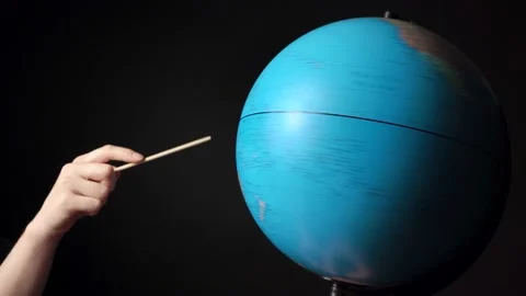 Video of rotating around blue globe with hand and pointer Stock Footage 134676042