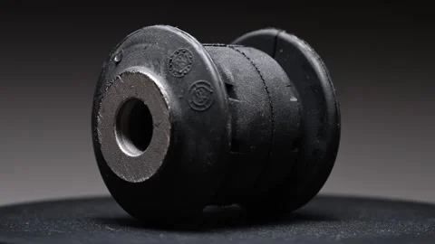 Video of a rotating bushing on a gradient background. A rubber and metal Stock Footage 328911408