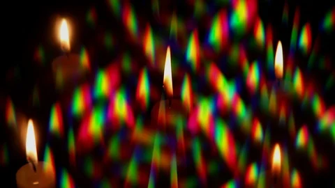 Video of rotating Diffraction Halos around a burning candle flame Stock Footage 120827002