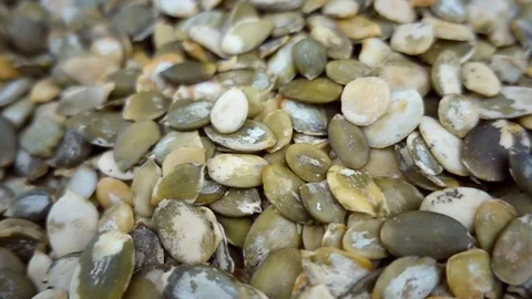 VIDEO, rotating in slow motion pumpkin seeds, healthy snack or ingredient Stock Footage 101667461