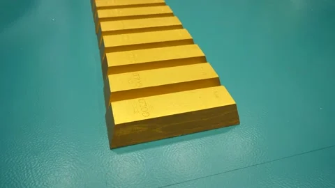 Video with a row of gold bars. Gold bricks. Camera moves over gold bars close-up Stock Footage 231508439