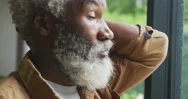 Video Of Sad African American Senior Man Looking Out The Window Stock Footage