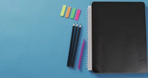 Video of school supplies, notebook, pens, marker pen over blue background Stock Footage 331358413