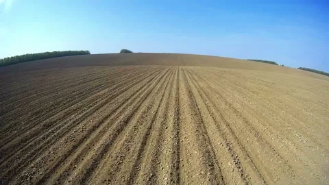 Video shooting from the cab of the machine running in the field. Video stock 92939191