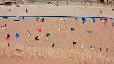 Video shooting from a drone of a sandy beach by the ocean with vacationing .. Stock Footage 249417868