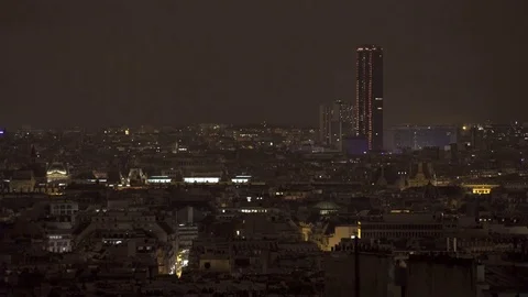 Video shot of central Paris rooftops at night with view of tall buildings Stock Footage 84681783