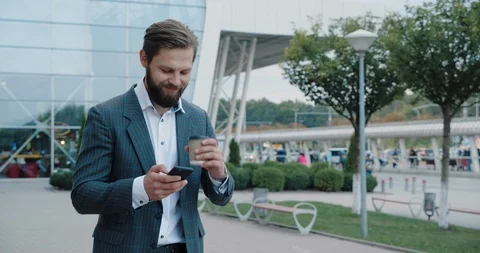 Video Shot from down of Handsome Bearded Businessman with cup of Coffee and Stock Footage 127127957